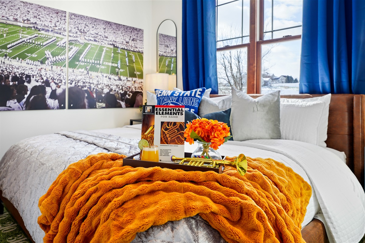 King bedroom inspired by Penn State’s Blue Band — cozy, quiet, and perfect for a restful night.