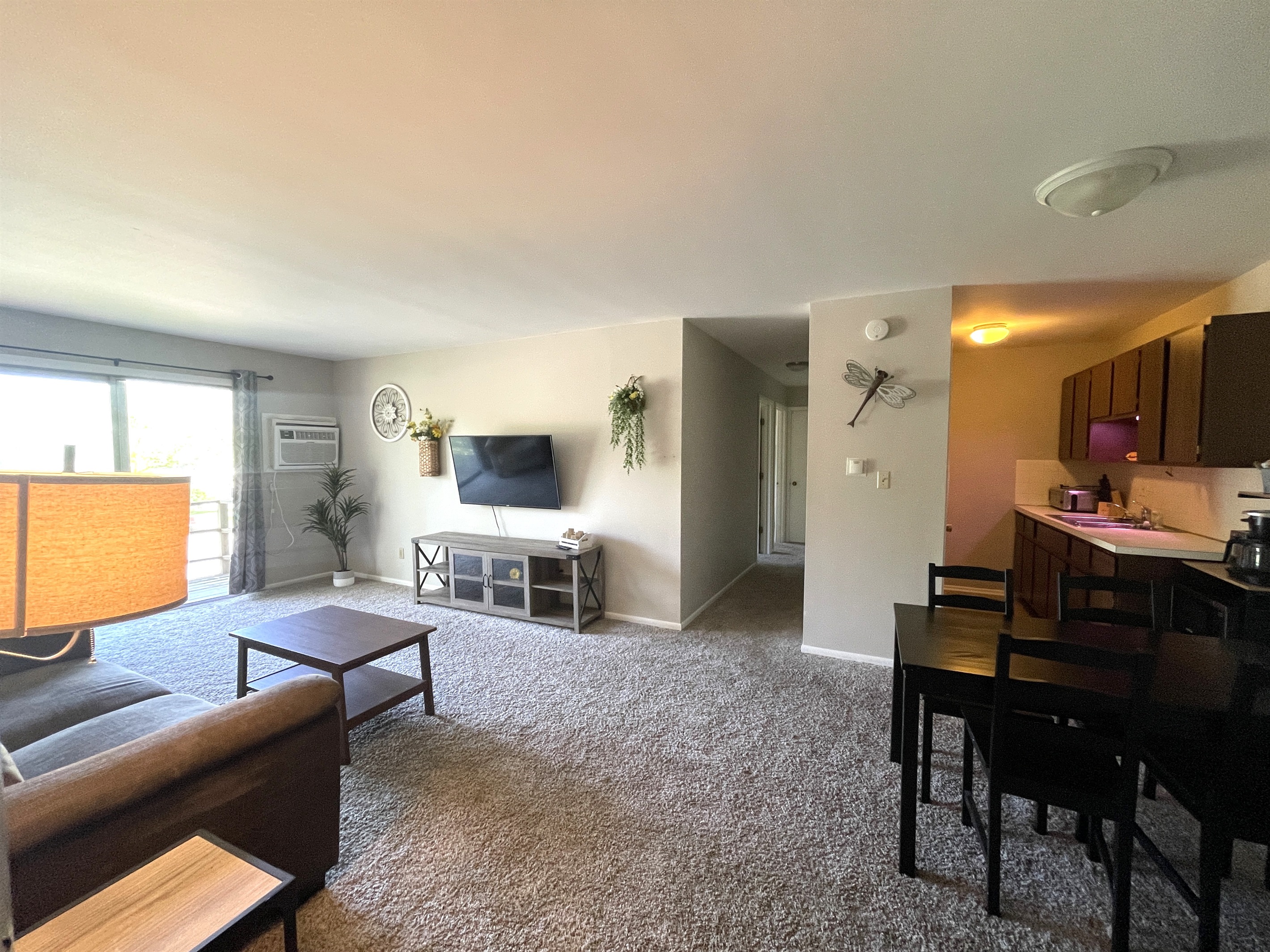 Open Concept Living Area with Dining and Full Kitchen