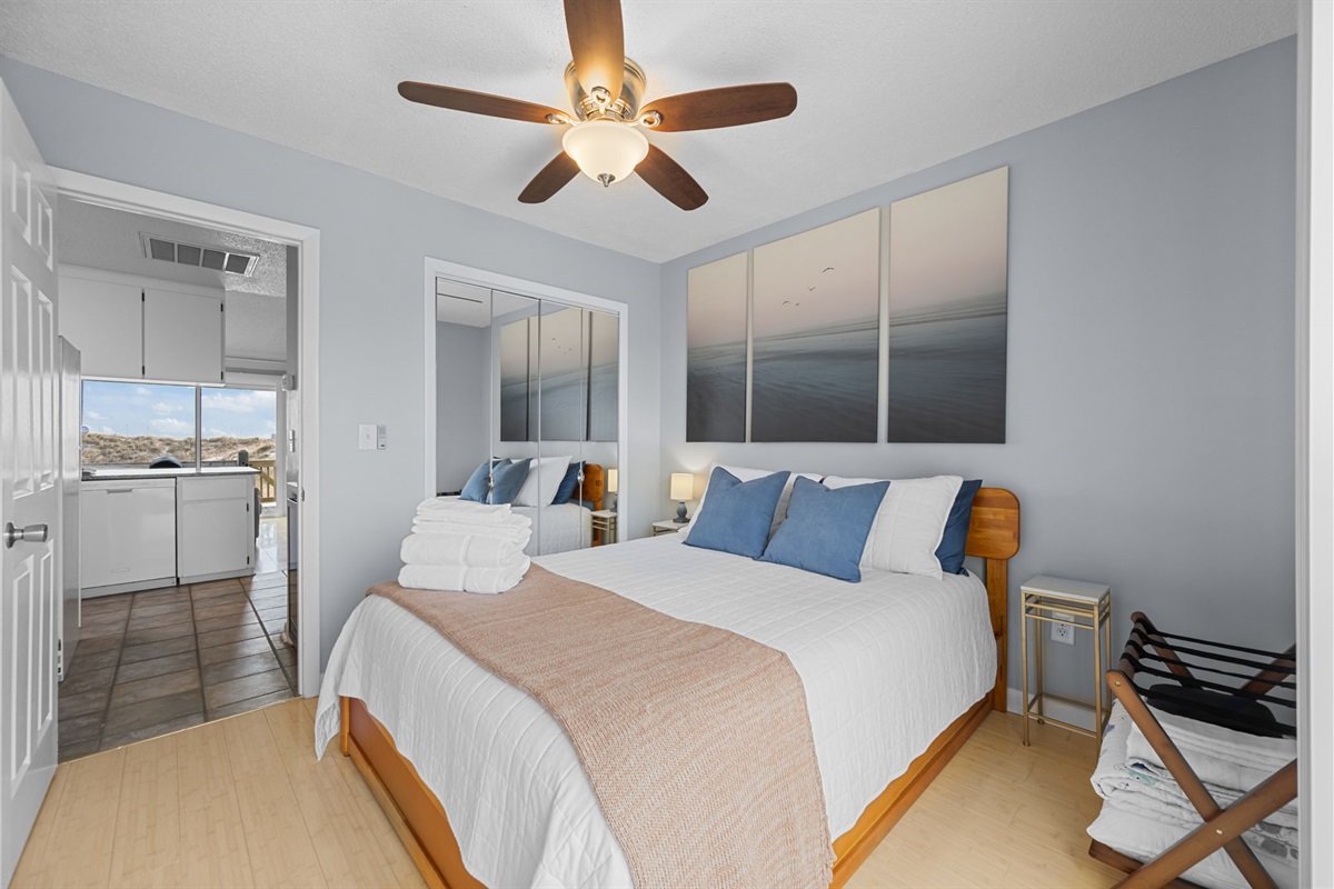 Master bedroom retreat with a queen bed, soft coastal tones, and plush linens for restful nights