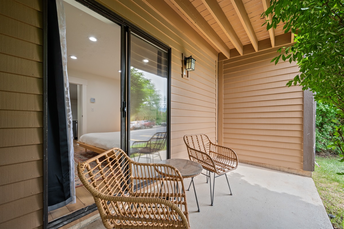 Enjoy peaceful moments and have a drink on the cozy bedroom patio with seating for 2.
