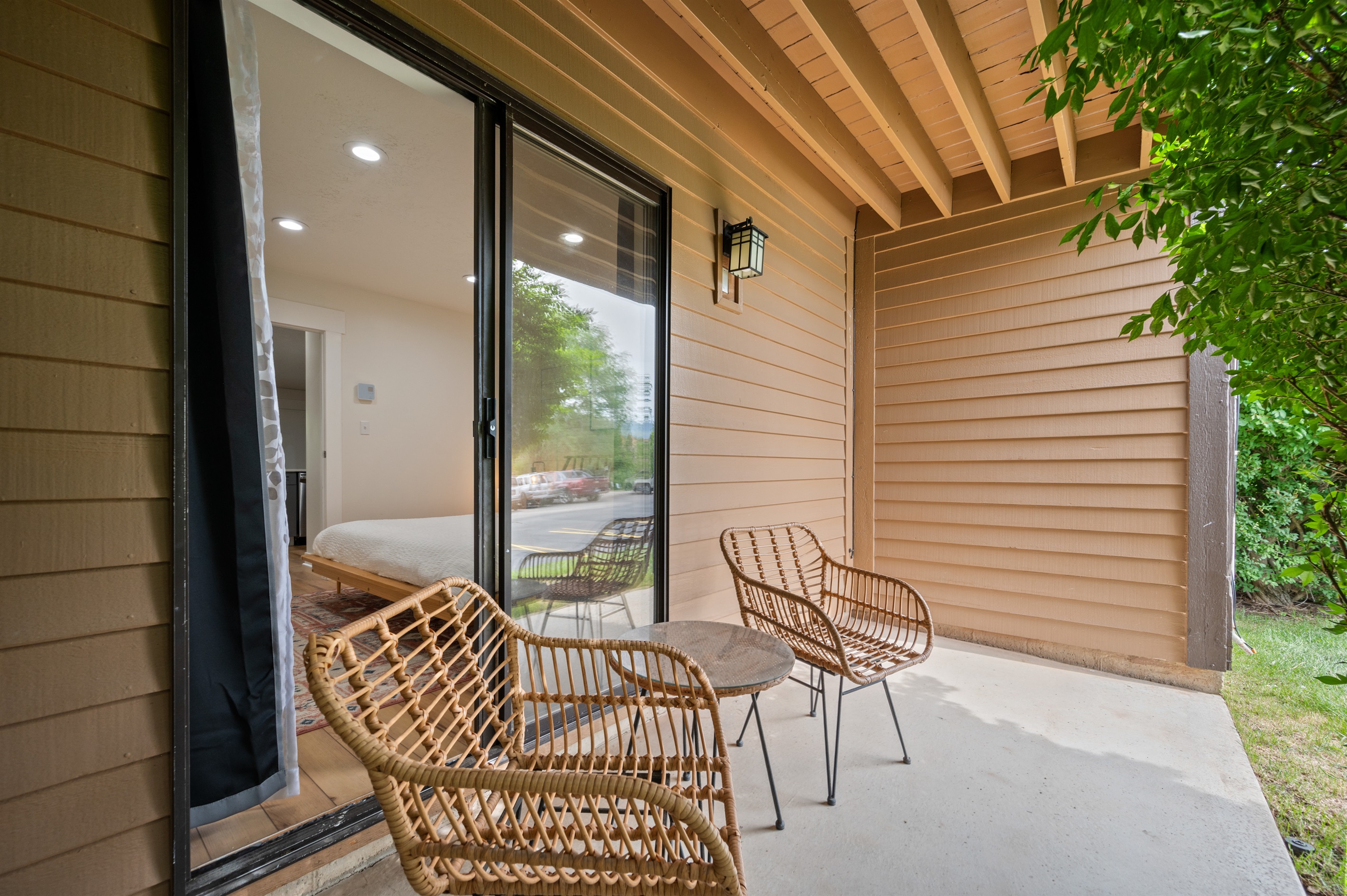 Enjoy peaceful moments and have a drink on the cozy bedroom patio with seating for 2.