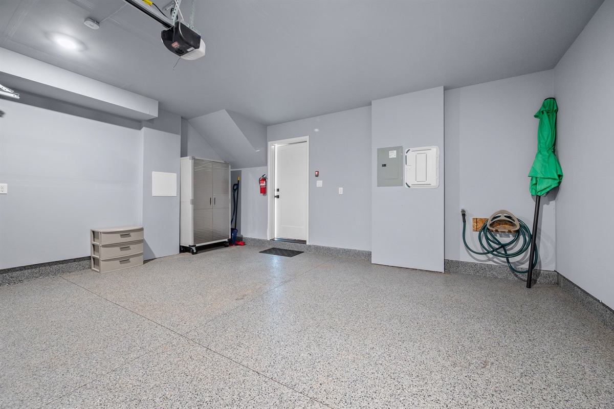 Spacious garage with room for gear storage.