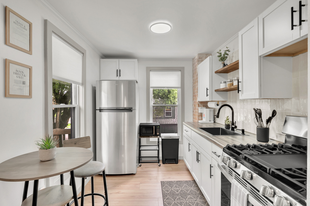 Remodeled kitchen with gas stove/oven, full refrigerator. Stocked with dry goods, kitchen essentials and cleaning supplies.
