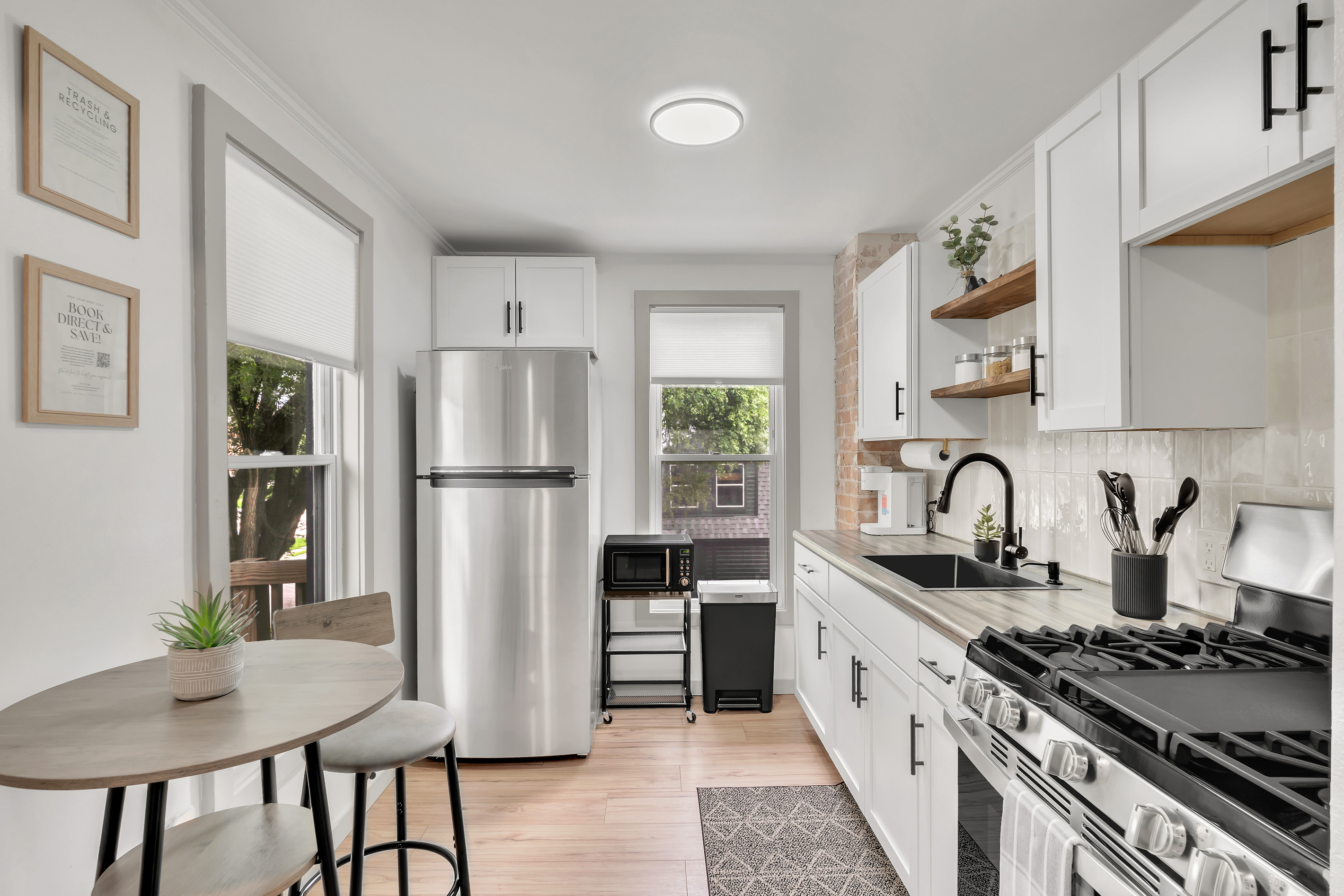 Remodeled kitchen with gas stove/oven, full refrigerator. Stocked with dry goods, kitchen essentials and cleaning supplies.