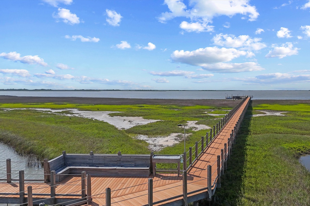 Enjoy scenic bay views and easy access to a host of amenities via a private boardwalk.