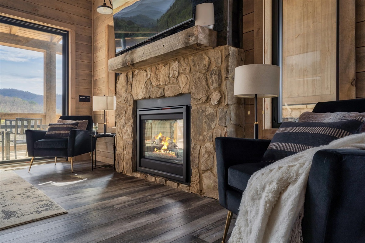 The dual-sided gas fireplace was custom designed to bring that mountain feel