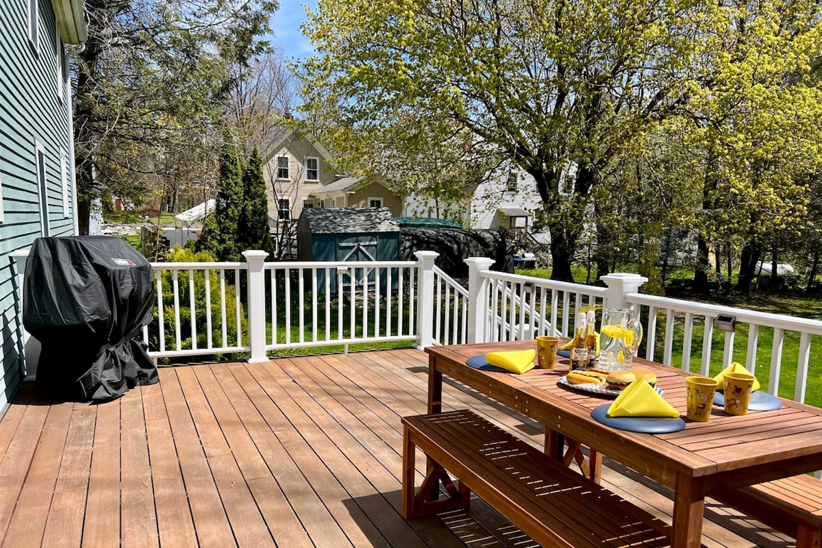 Outside deck and sitting area. Have the kids frollock around in the backyard