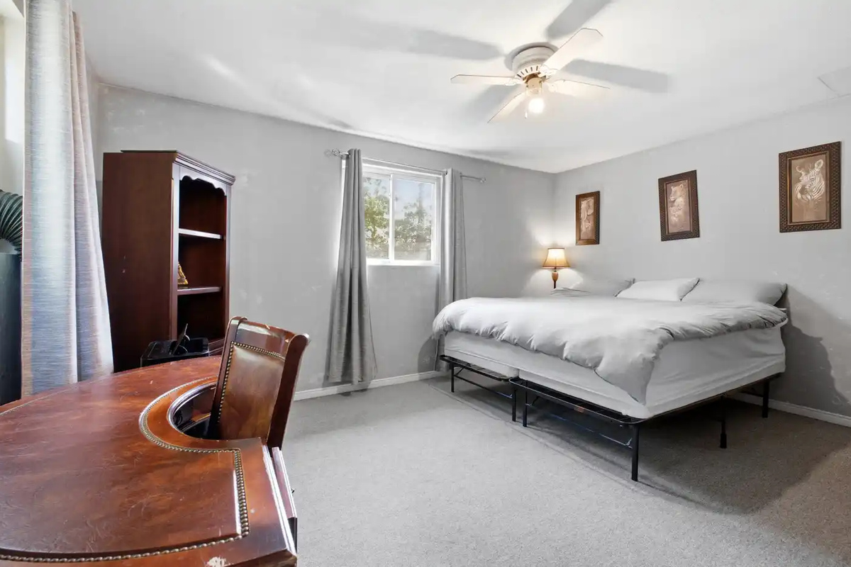 Comfortable bedroom with sofa bed and neutral decor