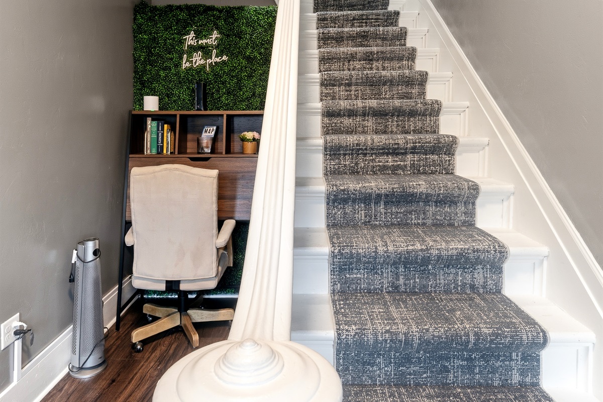 Shared workspace nook with desk and office chair.  Great for remote work!  Stairs leading up from foyer to the upper unit private entrance.
NOTE: This is a common-area foyer shared by guests in both units.