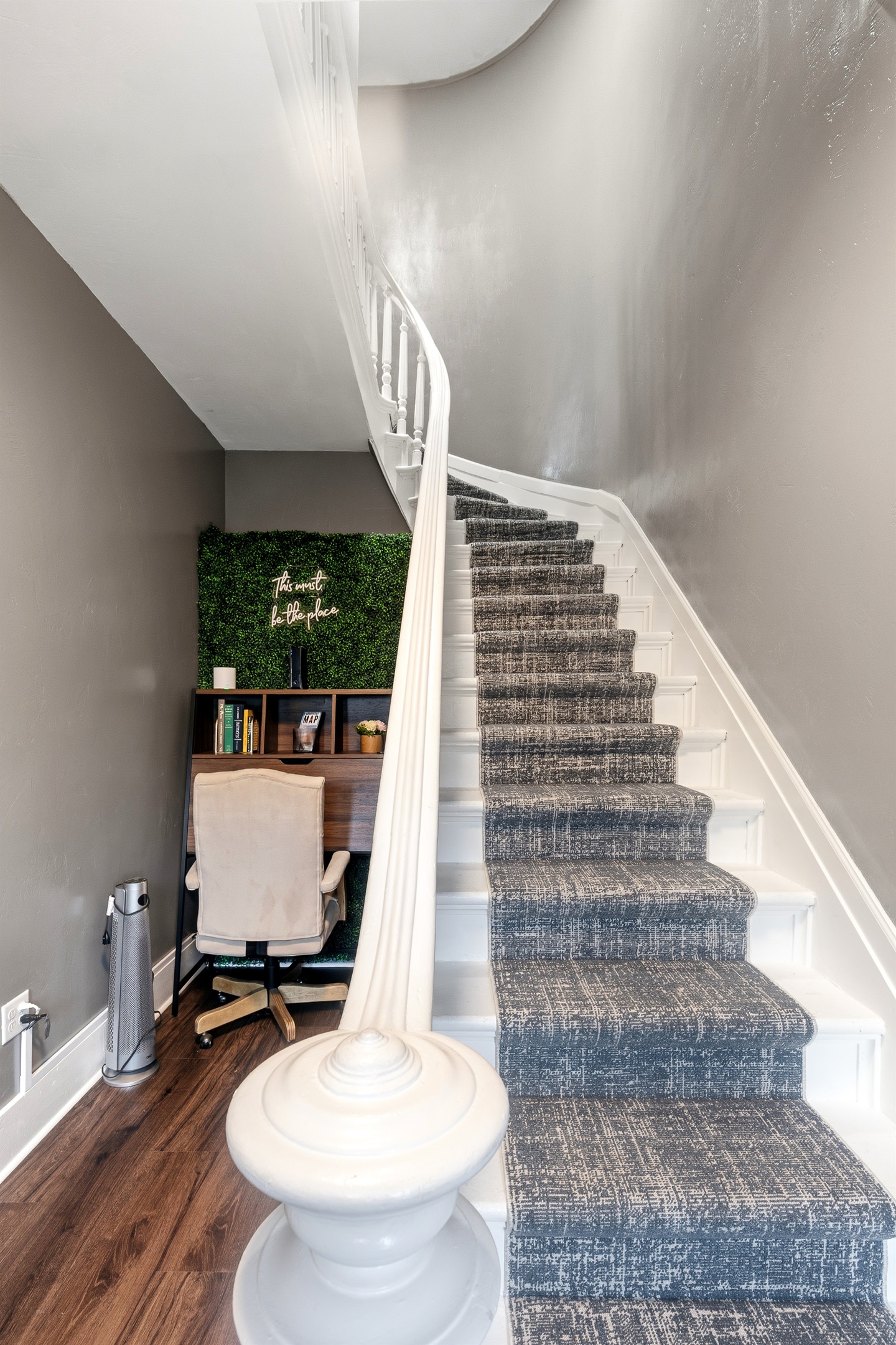 Shared workspace nook with desk and office chair.  Great for remote work!  Stairs leading up from foyer to the upper unit private entrance.
NOTE: This is a common-area foyer shared by guests in both units.