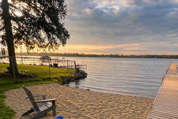 Beach area, boats will be on dock; This is a spring time photo. This area is shared with the few houses on the street. Dock is private and cannot be used. 