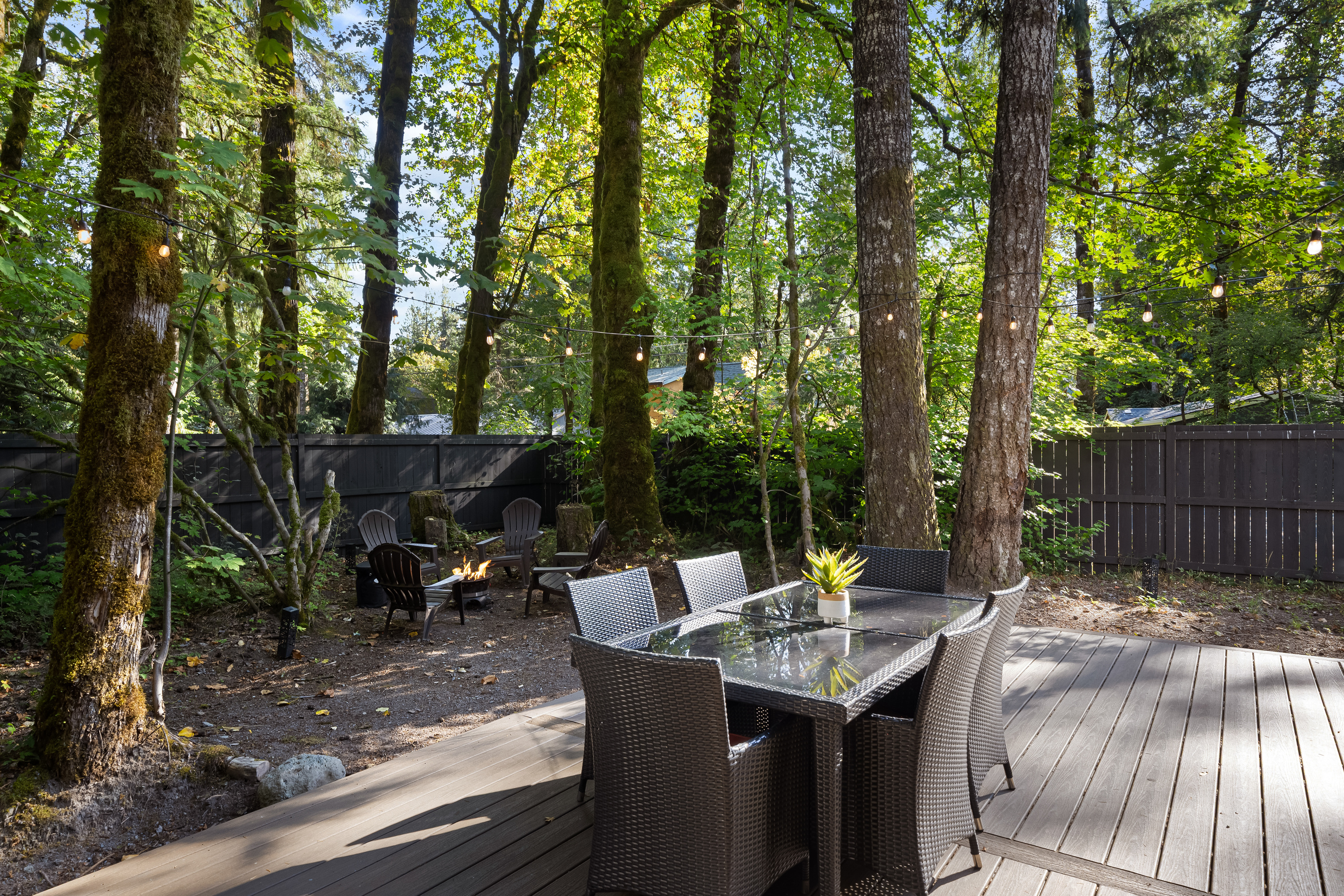 Dinner table by day, fire pit glow by night — all steps from your back door.