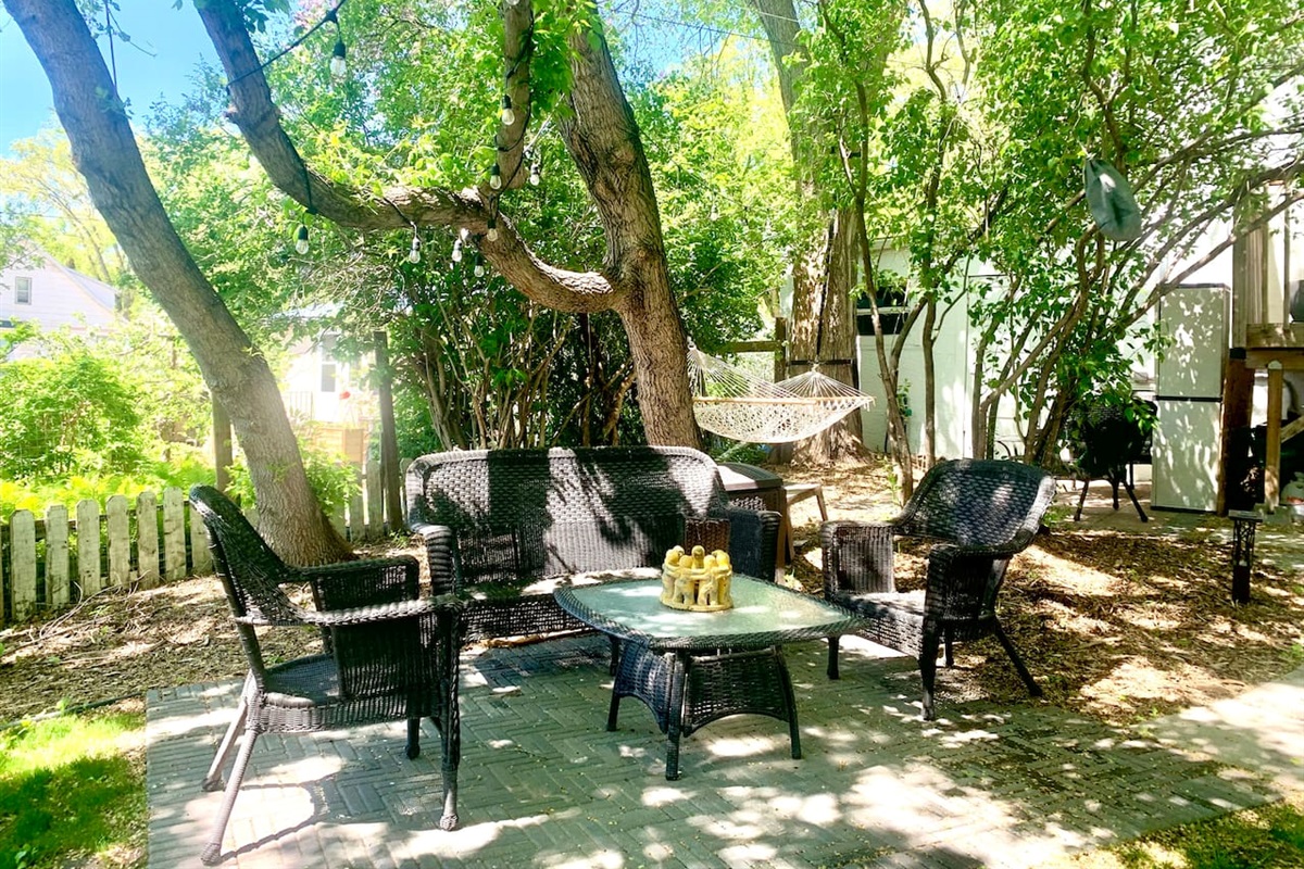 Patio conversation set under the large elm trees. 