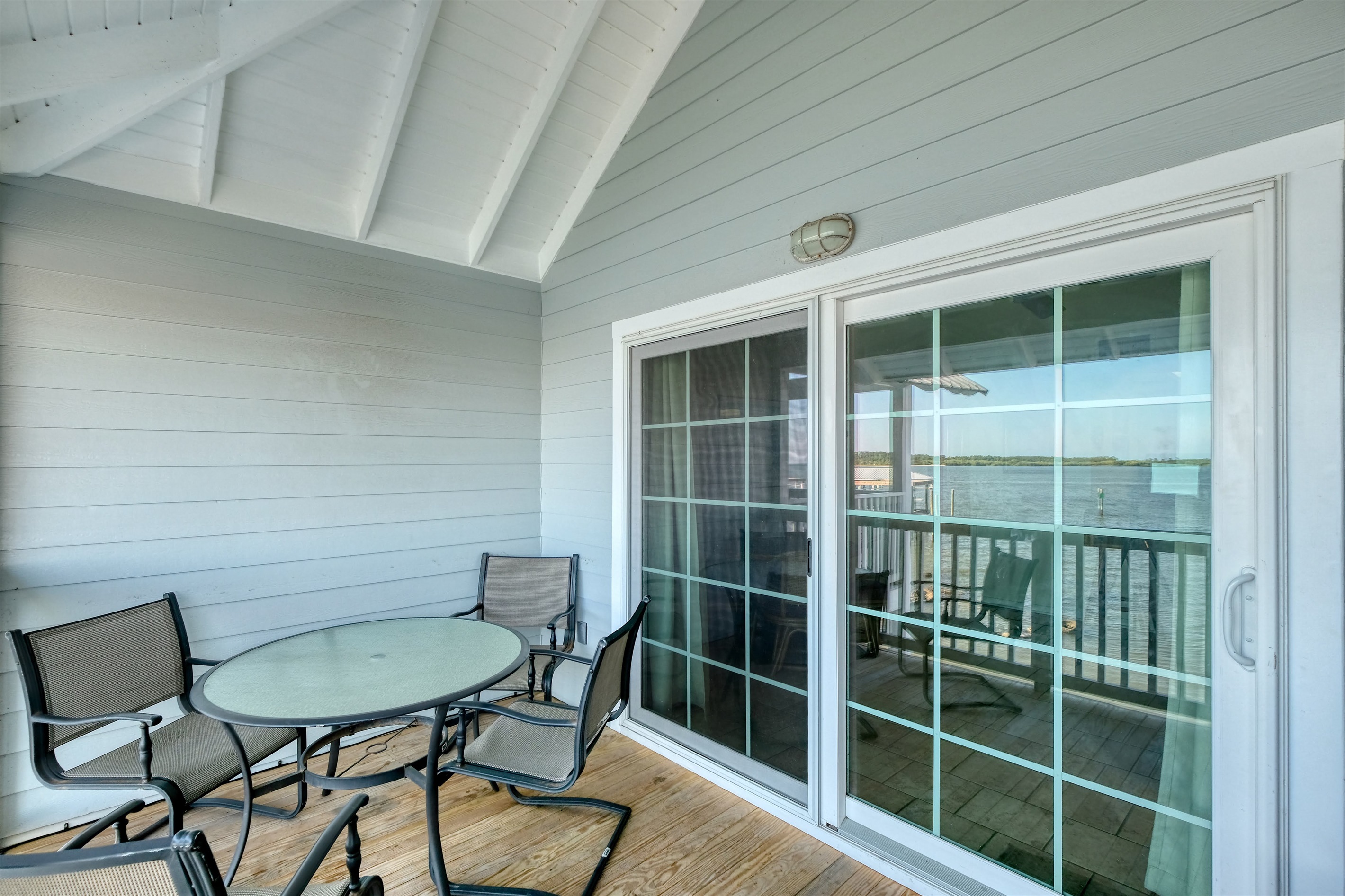 Large sliding glass doors lead to the private porch