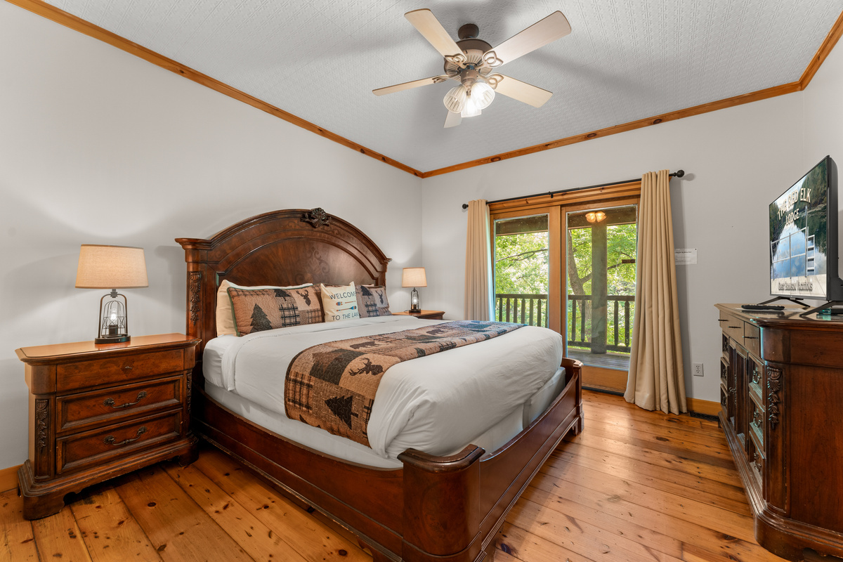 Bedroom #3 has a king size bed, deck access, and 50" smart TV with cable.