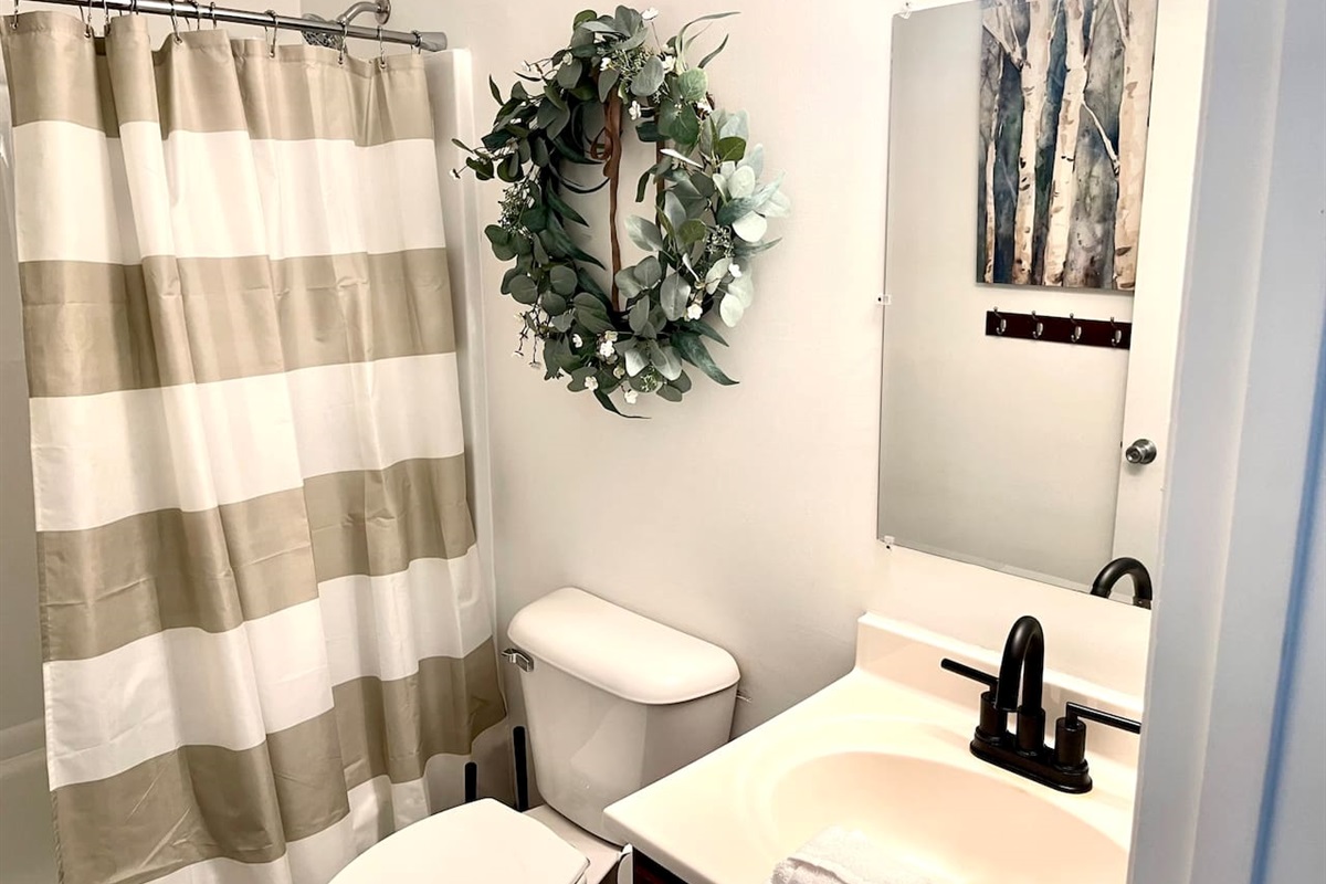 Full bathroom with tub and shower