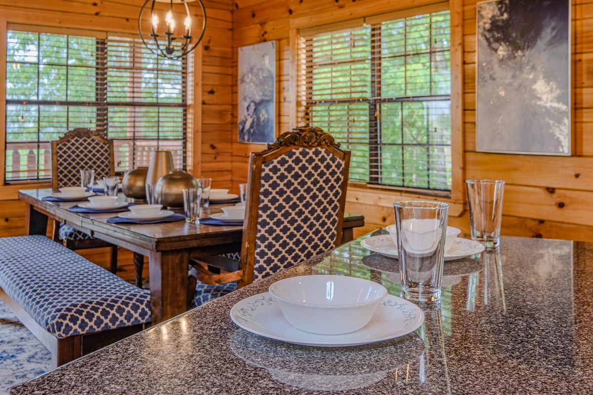 Kitchen island with dining area in the background