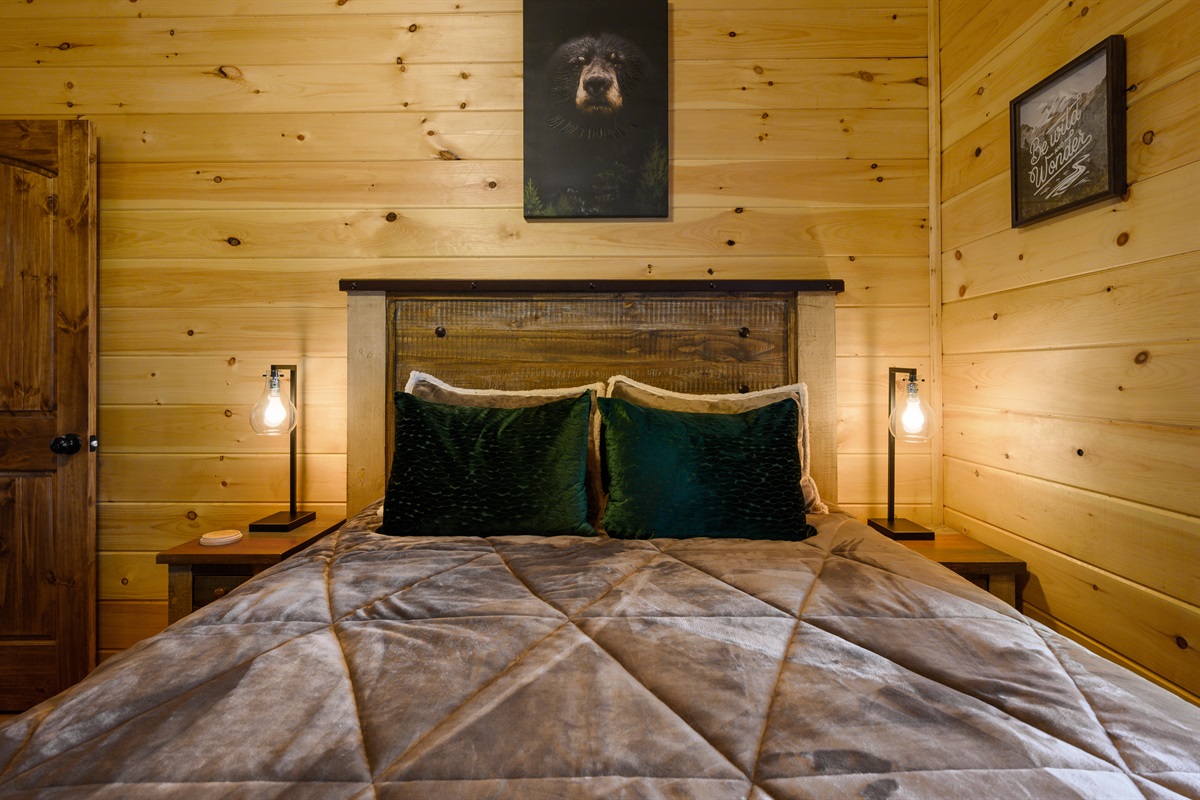 Downstairs queen bedroom with bunks in room as well