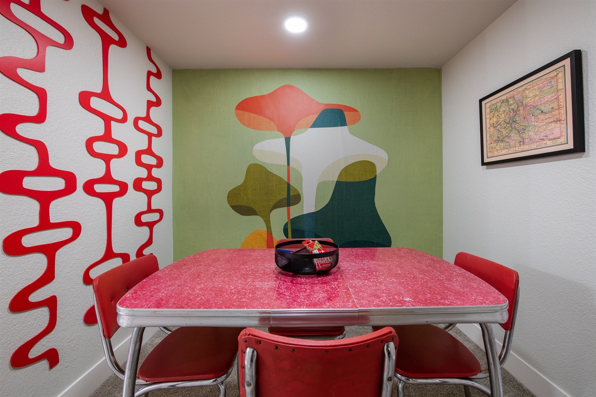 Card table and mushroom wall art
