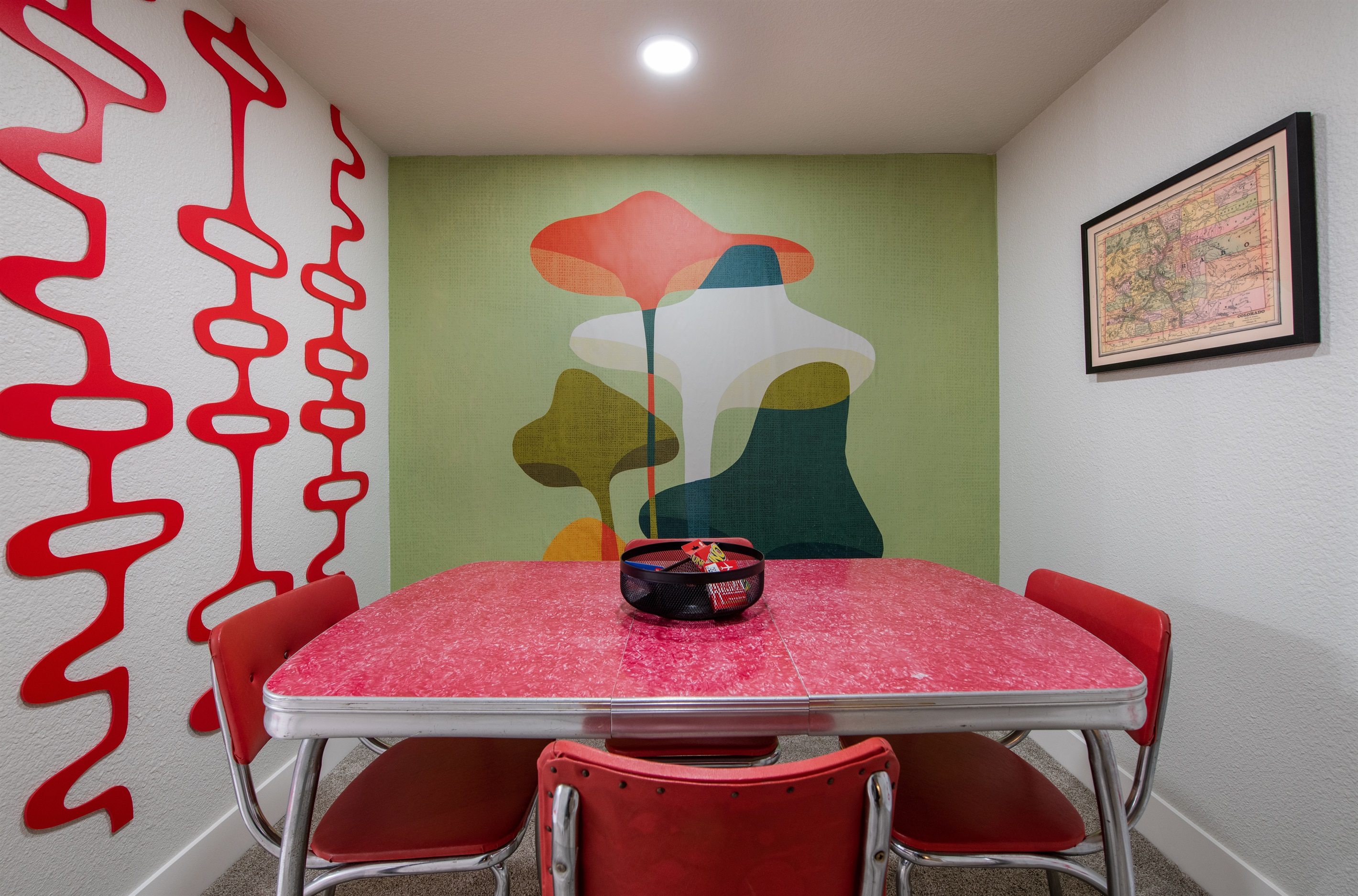 Card table and mushroom wall art