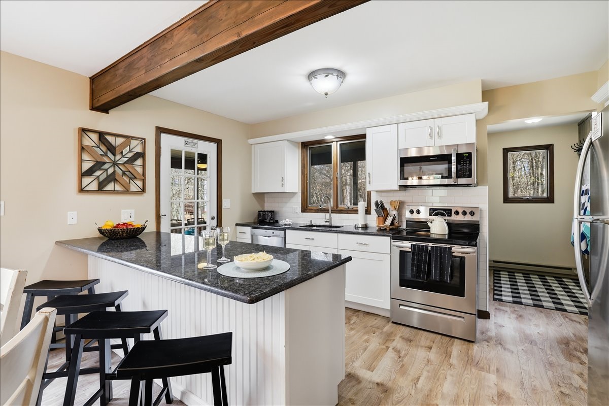The kitchen island with bar seating is the perfect spot for morning coffee, casual meals or keeping the cook company