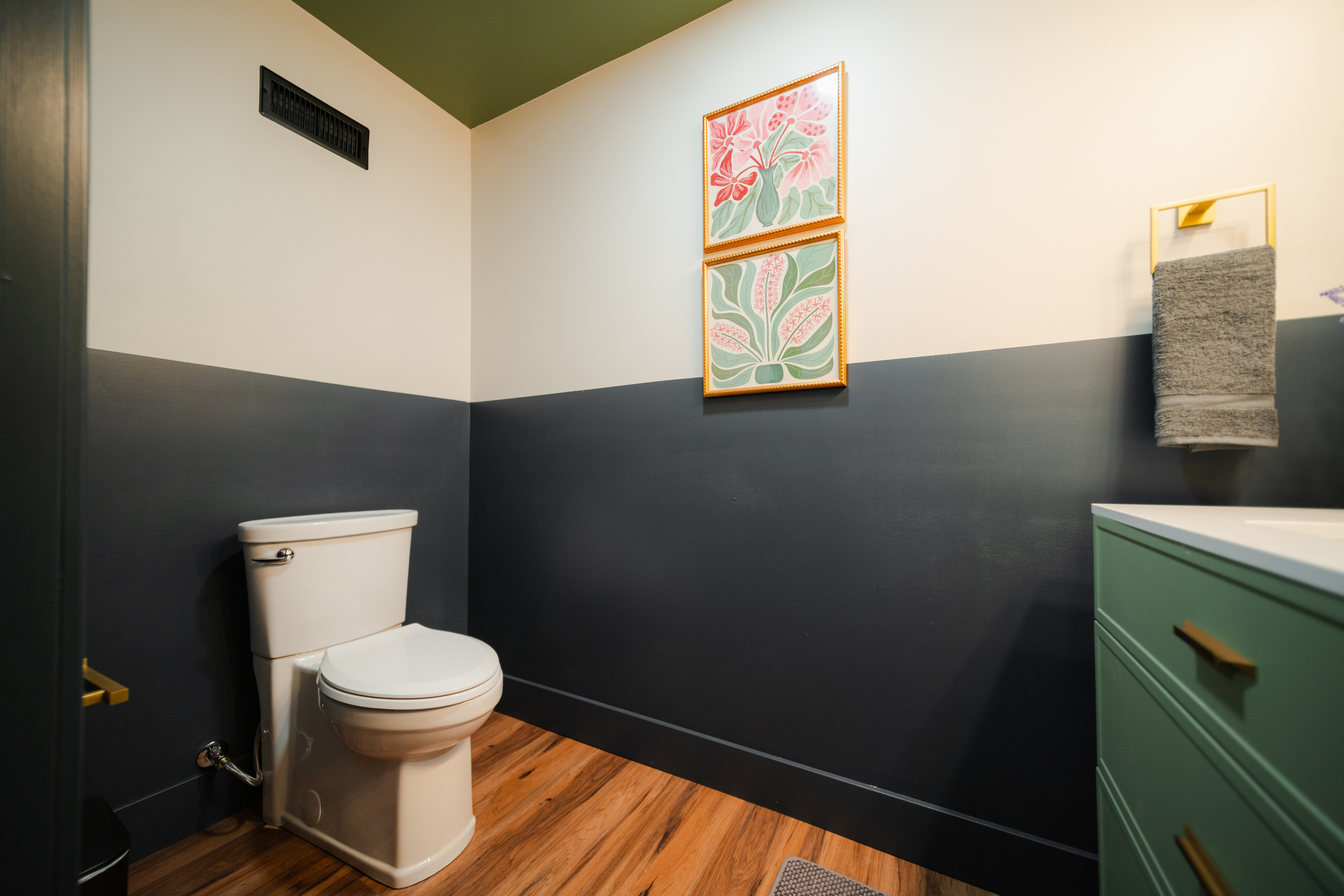 Lower-level entertainment lounge with a convenient half bath.