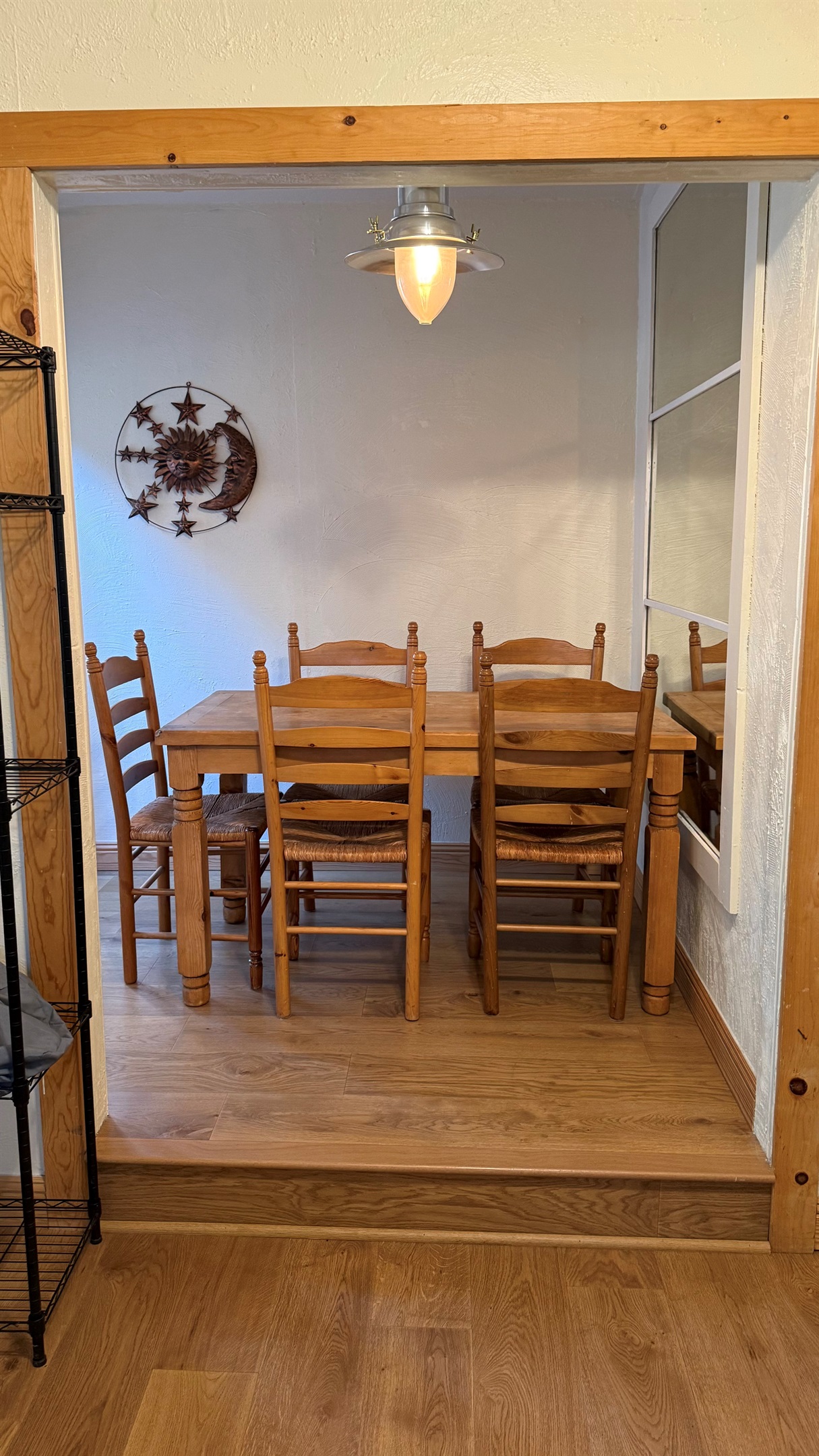 Cozy dining nook with seating for four, ideal for shared meals or use as a dedicated workspace during your stay.