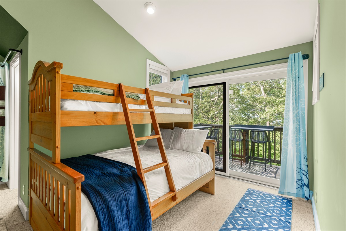 Wake up to filtered treetop views and crisp mountain air. This bright corner opens to the private vista balcony—peaceful and invigorating