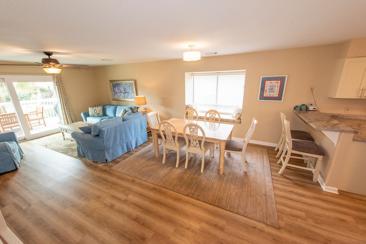 Slide the door open and the deck becomes part of the living room &mdash; your whole group moves outside naturally, because the Gulf is right there calling.