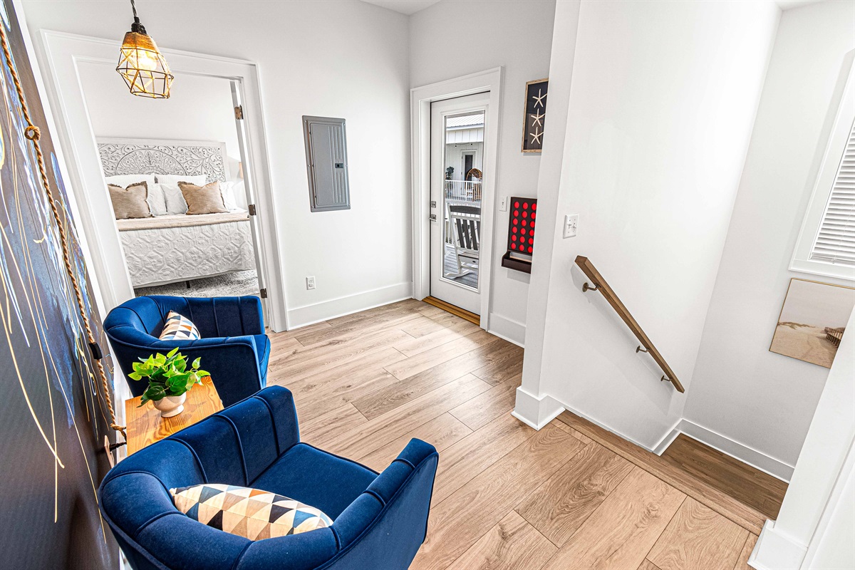 The upstairs landing is a great respite to get away from it all. Head out on the balcony, plug in the party lights and rest in the egg chair.