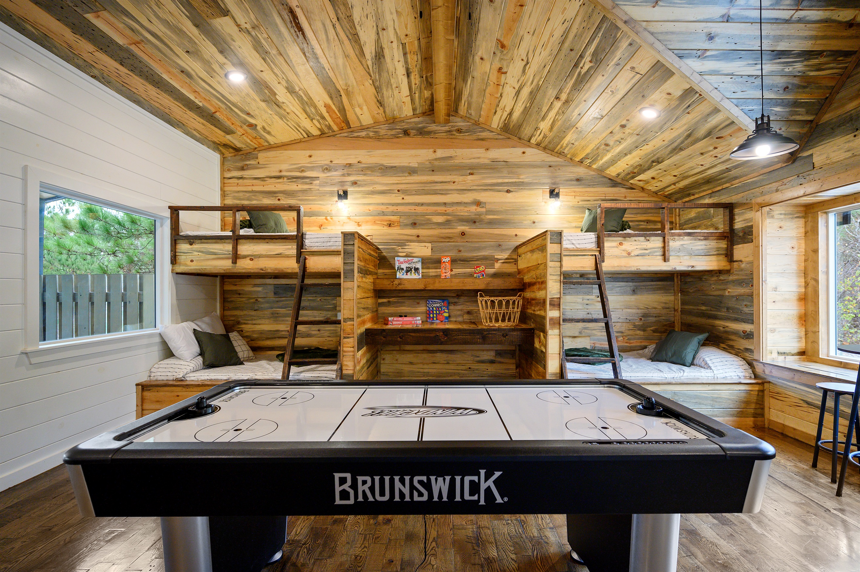 Upstairs bunk room fun with built in core memory potential. 
Late night laughs, tournament rematches, and cozy cabin sleepovers all in one unforgettable hangout space.