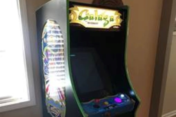 Vintage stand up video game with 60 old school games like Galaga, Centipede, all the Pacmans, Donkey Kong, etc. Bringing back childhood memories and adding some for the kids. 