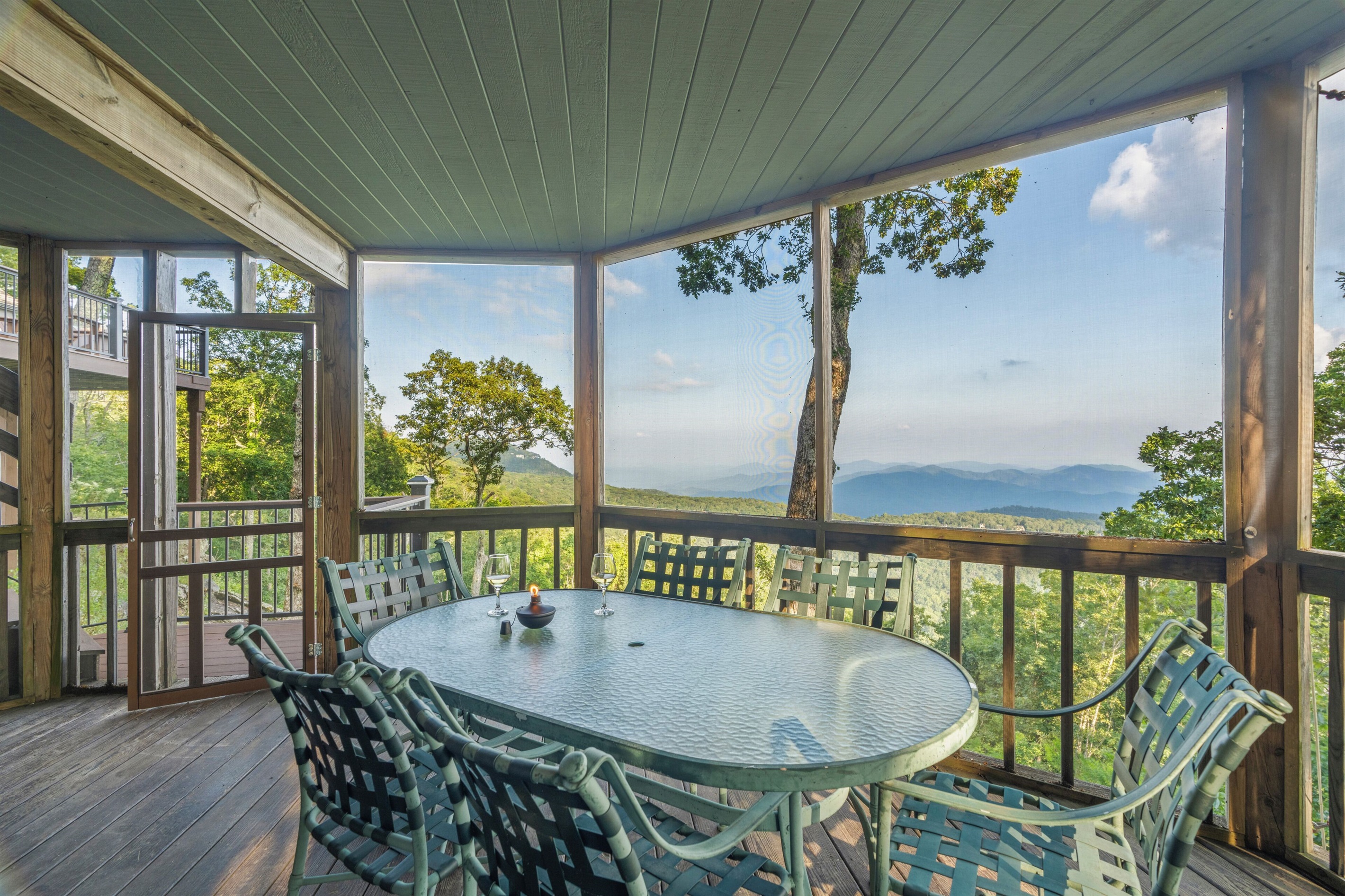 Screened in porch on lower deck
