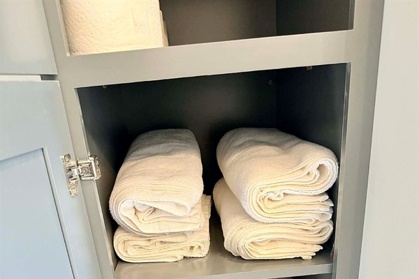 Towels, lines, pillows, and toiletries are included.
