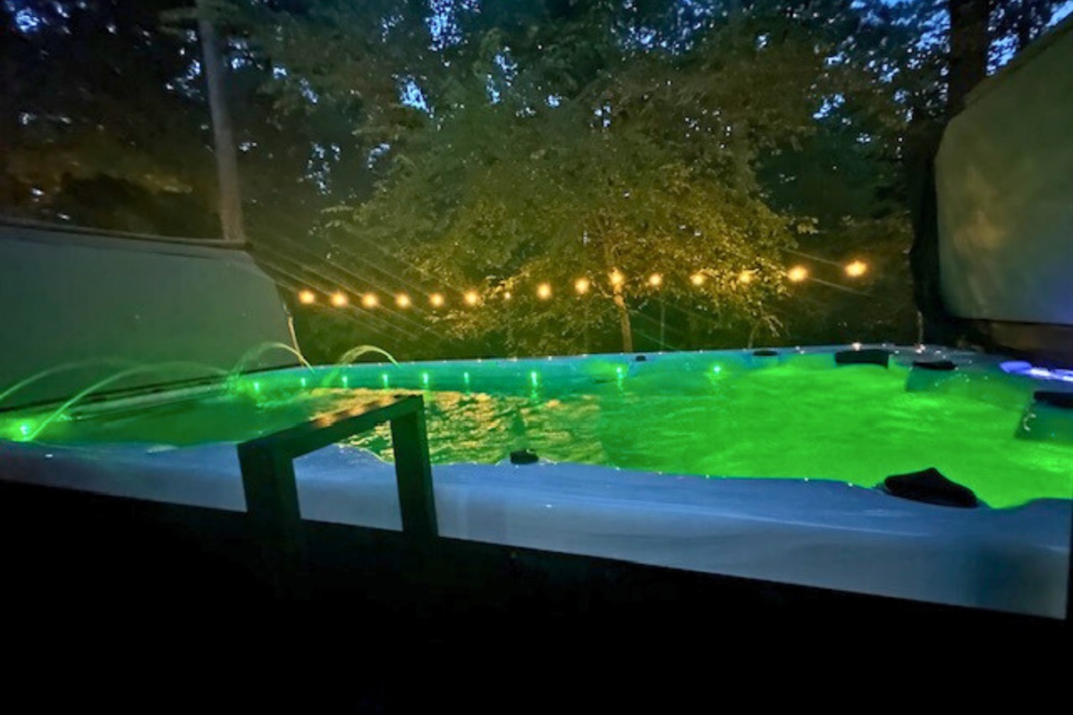 Unwind in the swim spa with color-changing lights, adding fun and tranquility to your stay.