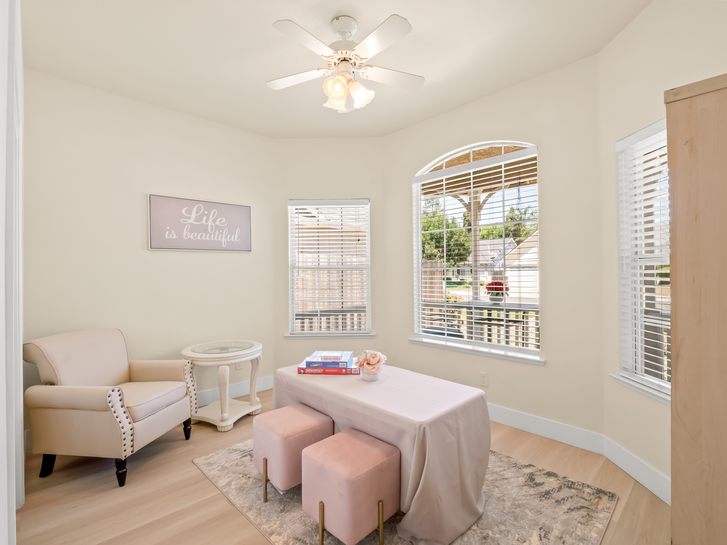 Enjoy a peaceful retreat in this charming bonus room, thoughtfully designed for relaxation, games, reading, or quiet conversation. Large windows fill the space with natural light, creating a bright and welcoming atmosphere.