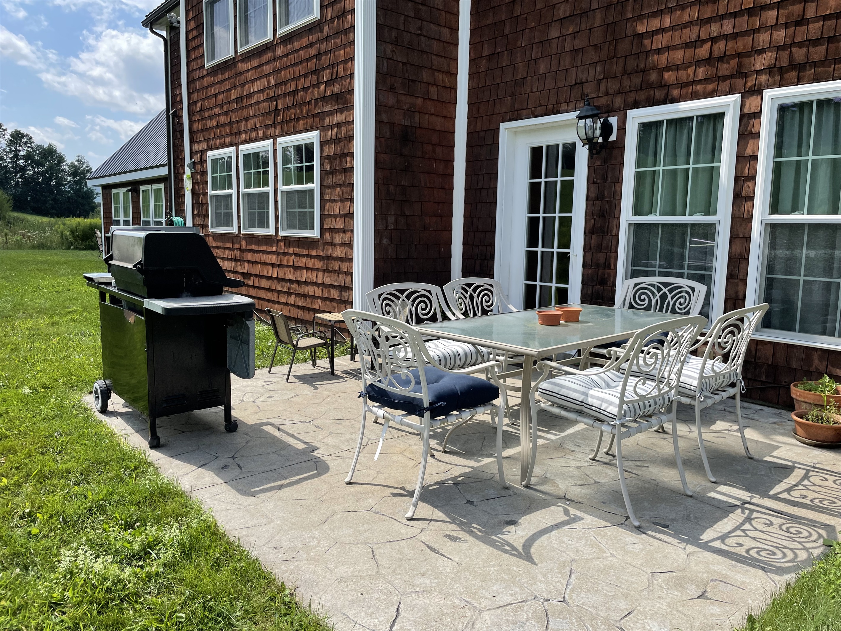 Outdoor dining and grill on back patio