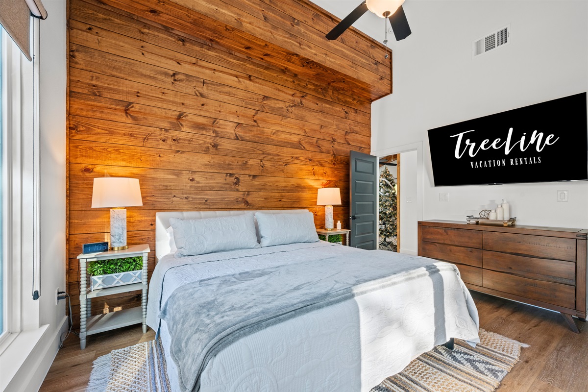From this perspective, the bedroom’s layered textures, soft lighting, and wood accents really come together.