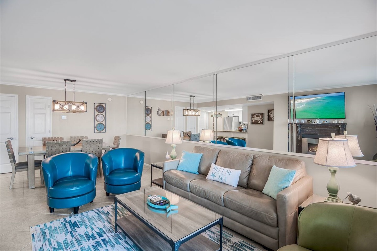 Stylish, spacious living space with GULF views from the 4th story balcony + leather furniture, Queen sleeper sofa, 58" Smart TV, Fireplace, and balcony access