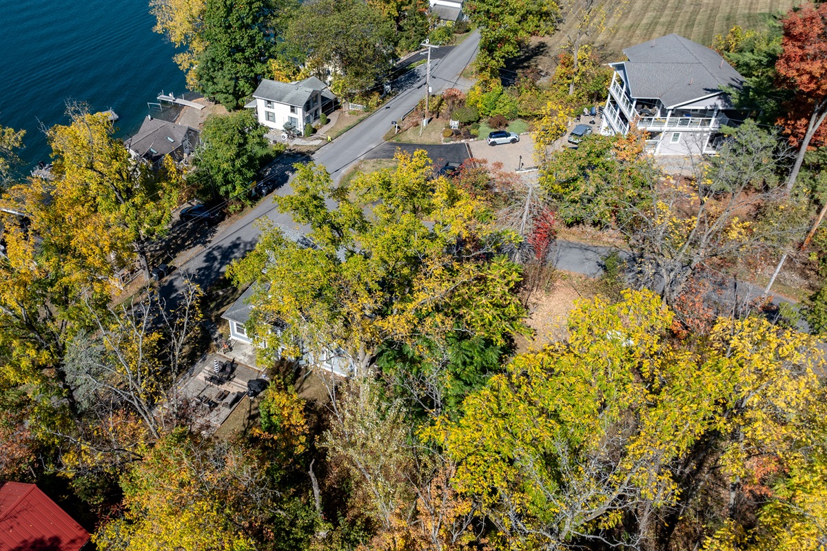 Charming bend in the road with peekaboo lake views and easy access to waterfront adventures
