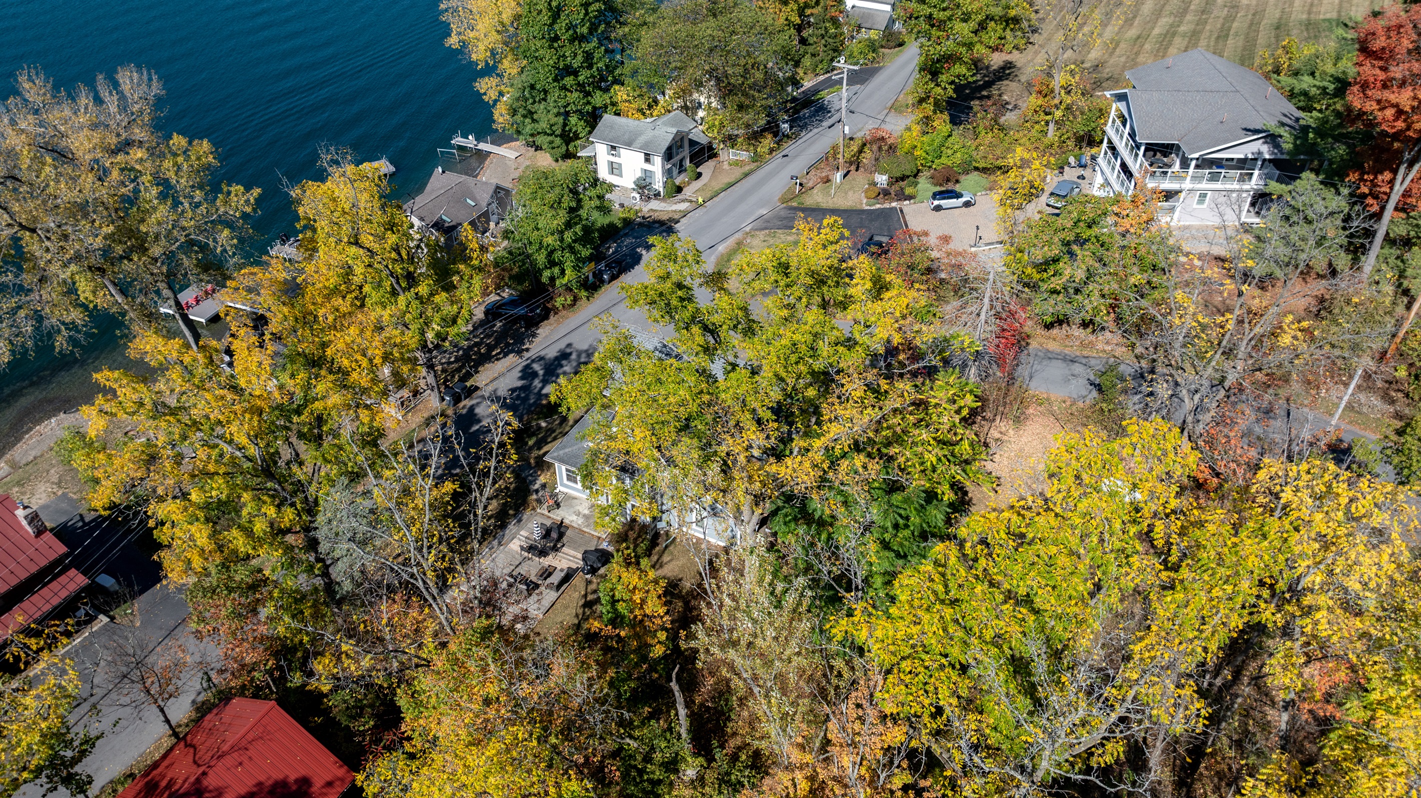 Charming bend in the road with peekaboo lake views and easy access to waterfront adventures