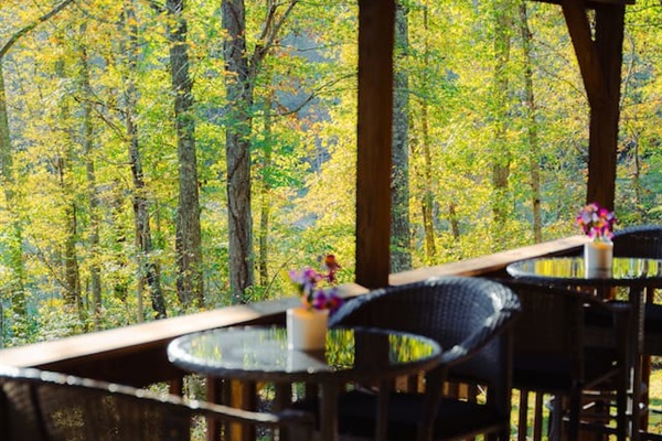 Enjoy a quiet moment at the outdoor dining table, surrounded by nature.