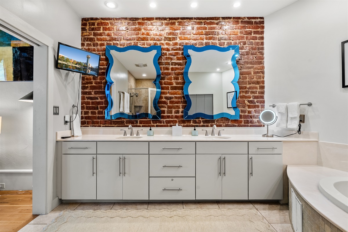 Modern ensuite featuring a spacious walk-in shower and relaxing jetted tub.