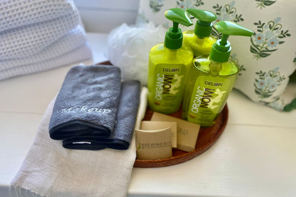 Pack a little lighter: Heritage House bathrooms are stocked with organic bath products, plush towels, dedicated makeup cloths and thoughtful extras such as a shower cap and sewing kit. Small comforts, ready before you even knew you needed them.