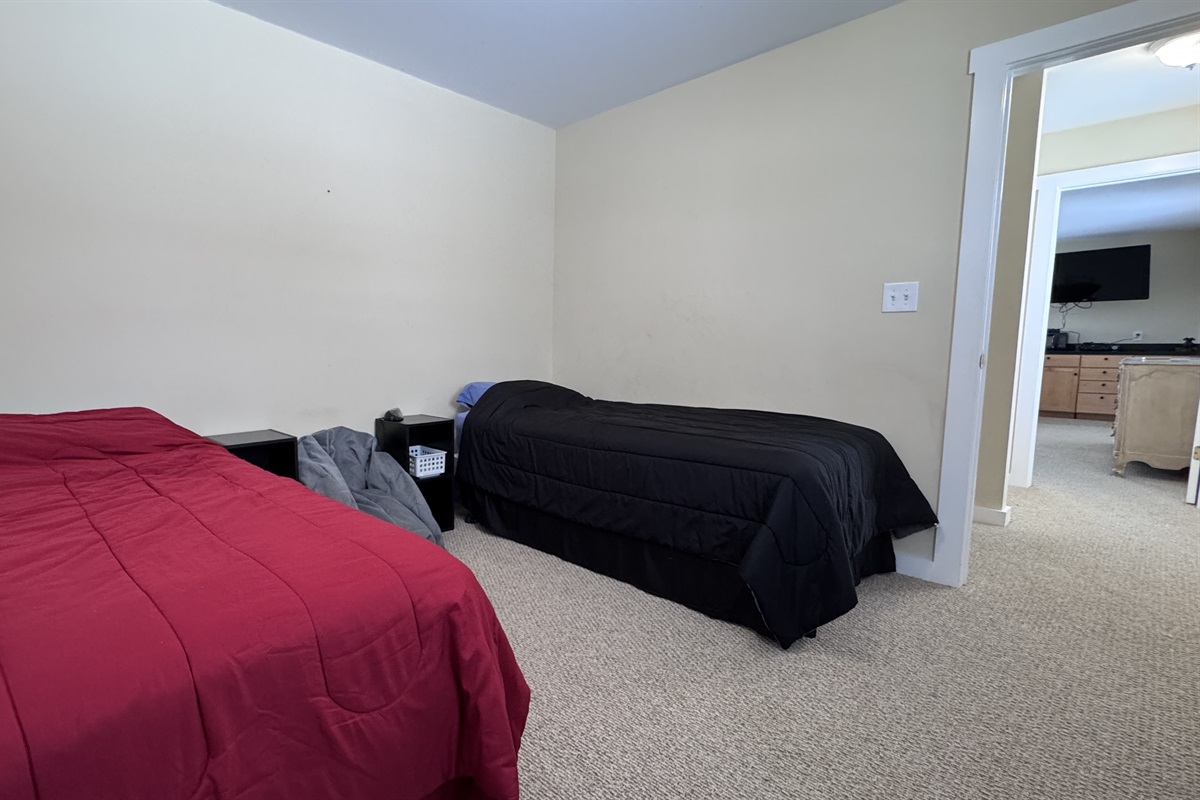 3rd bedroom with 2 twin beds and a desk