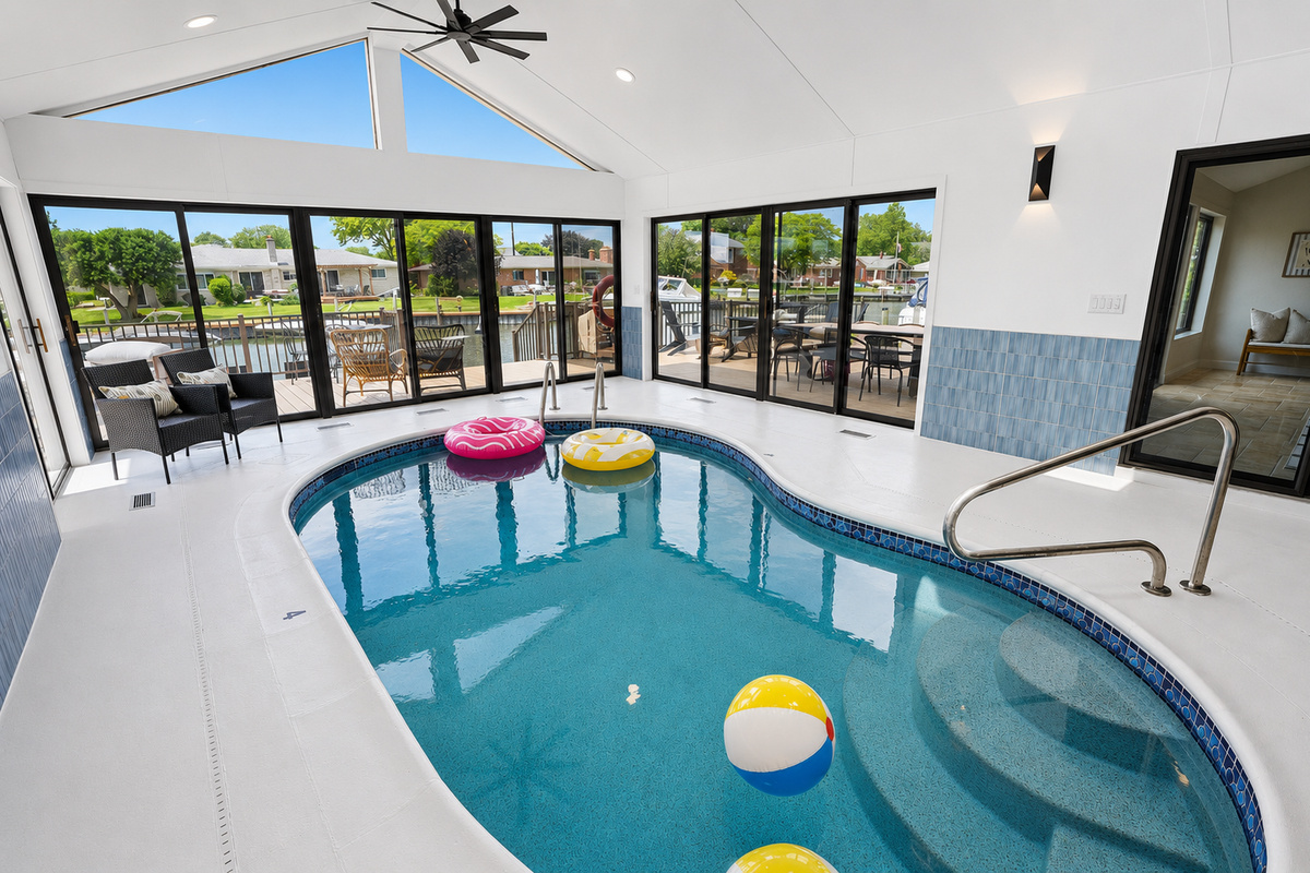 Enjoy year-round swimming in the private indoor heated pool, surrounded by soaring ceilings, skylights, and walls of windows that fill the space with natural light.