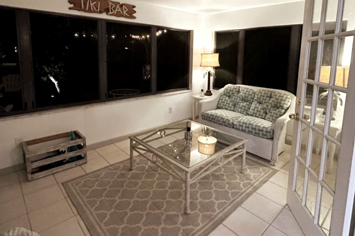 Screened Lanai, create an extension to the outdoors by simply opening up the double french doors to the screened lanai for some fresh air and sunshine inside! or relax on the comfortable furniture while enjoying a nice book or nap