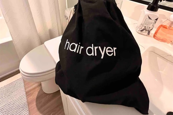 Hair dryers in both bathrooms.
