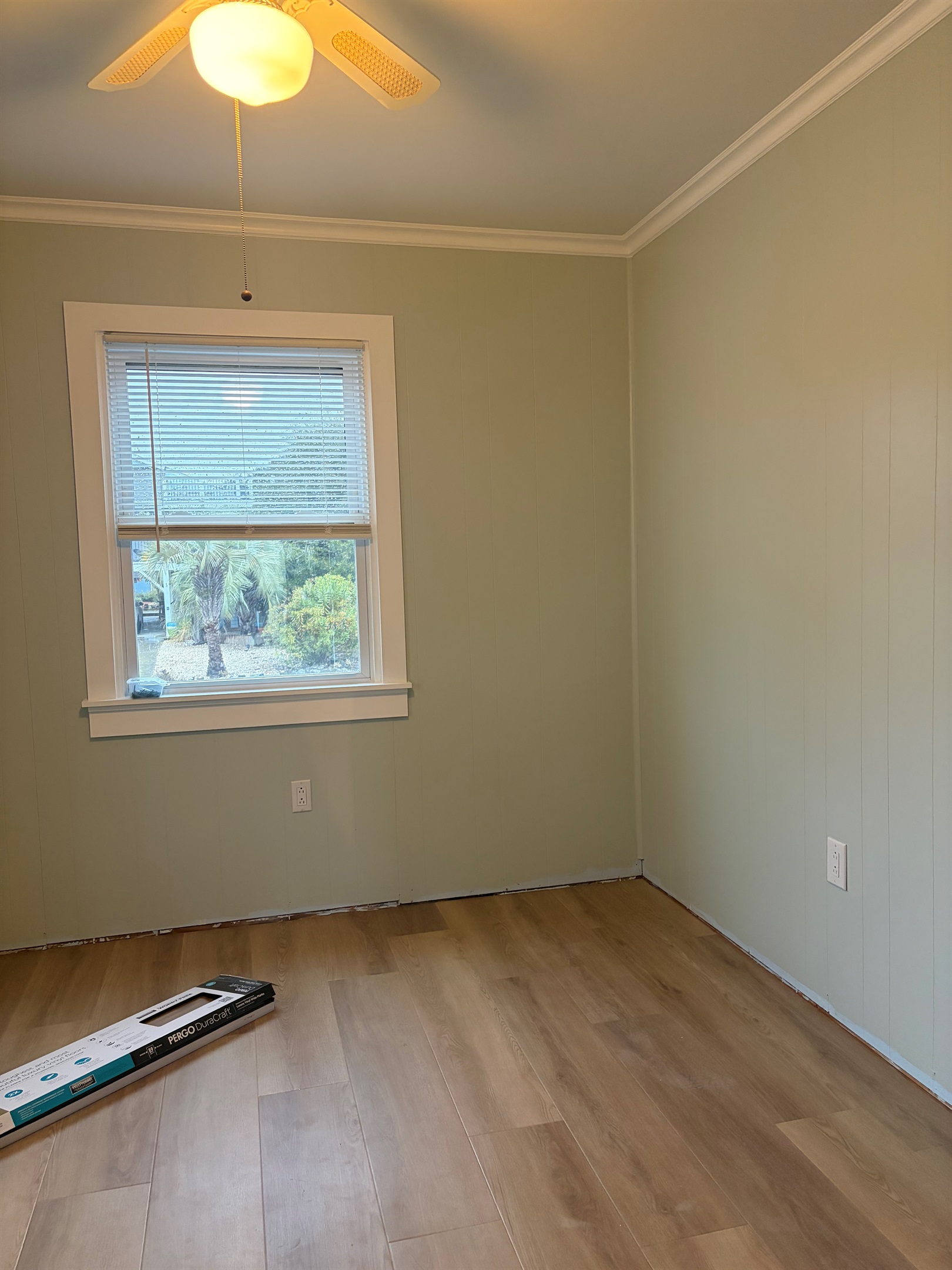 Bedroom walls are painted, crown installed and flooring is started!