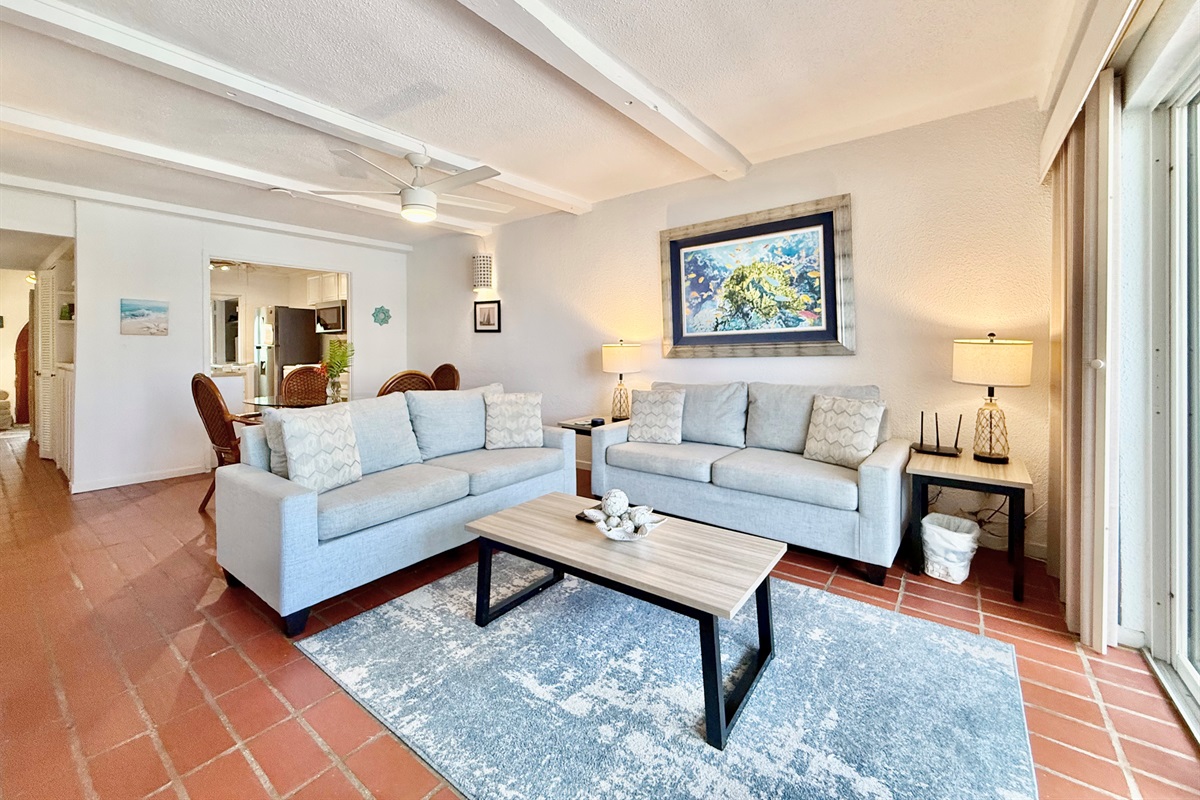 Spacious living room opens to balcony